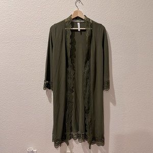 Lightly used . Tickled Teal . Small . Olive green Cardigan . Lace trim detail .